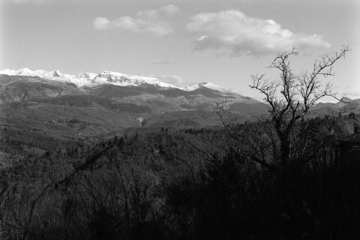 A view towards Vikos Gorge from Elati in Zagorohoria with snow topped mountains in the distance