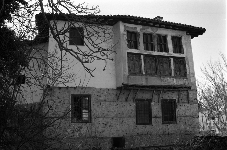 A traditional old house with wooden supports in the old town of Kastoria