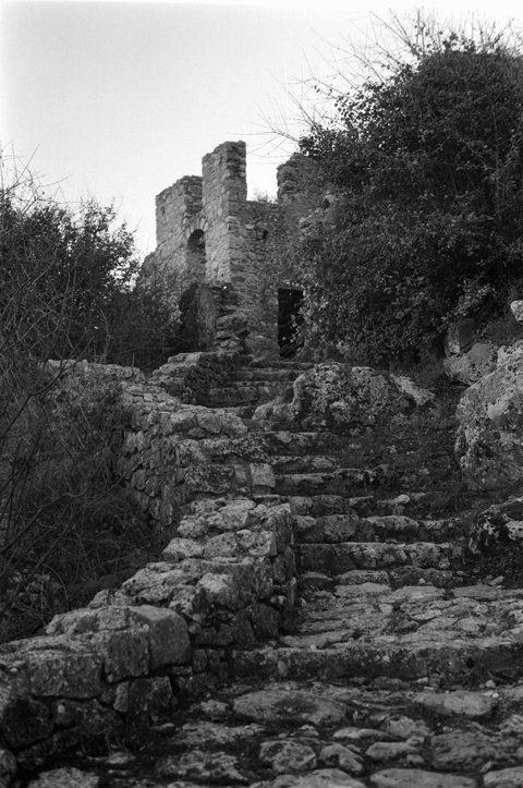 A stone staircase leading through the old city of Mystras in Greece