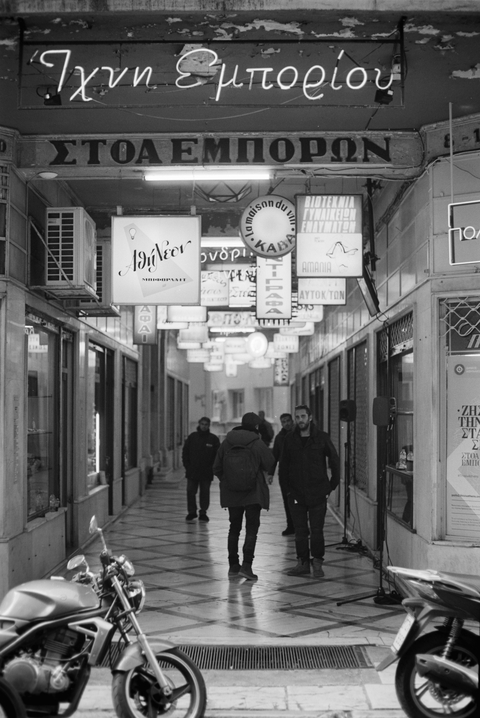Neon and backlit signs in an old shopping arcade in athens