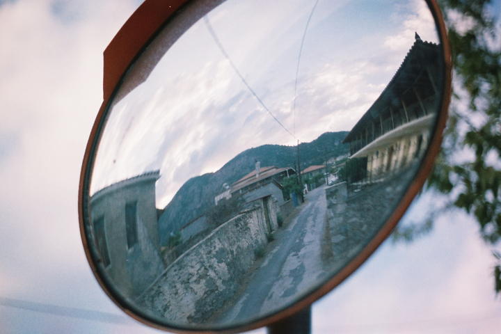 Refelection of a backstreet in a convex mirror in the town of Xirokampi