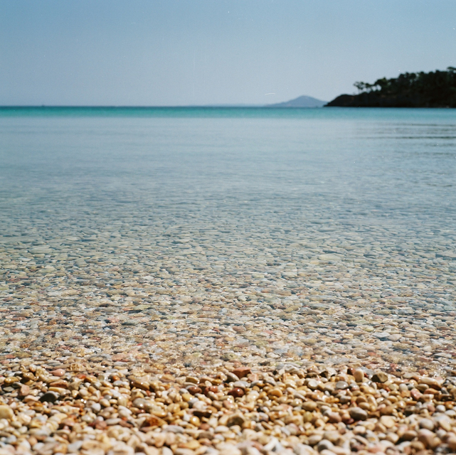 A view out from the pebbled beach of Tzortzi Gialos beach