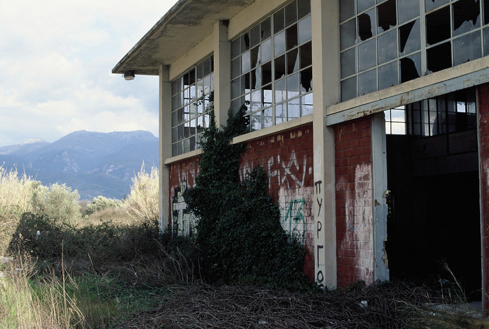 An abandoned building with broken windows