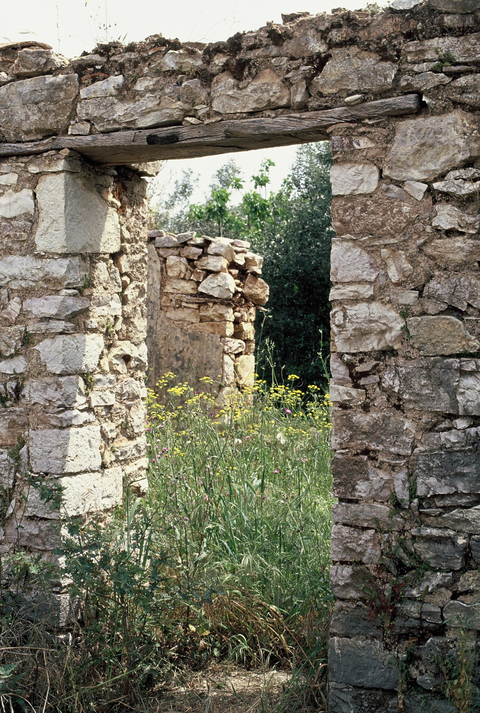 Stone doorway of a derelict house in the old town of Aetofolia