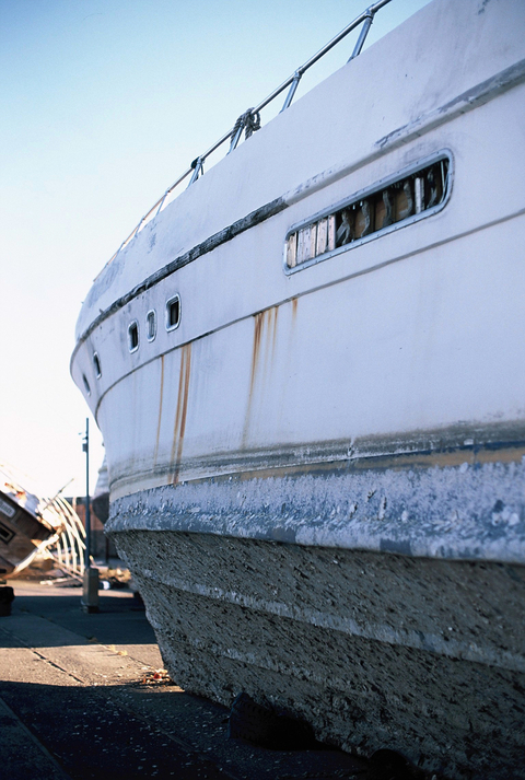 Abandoned and rusty boat on the banks of the Port of Kalamata