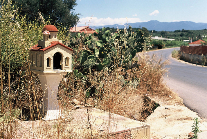 Elaborate roadside memorial on a sharp bend in the road
