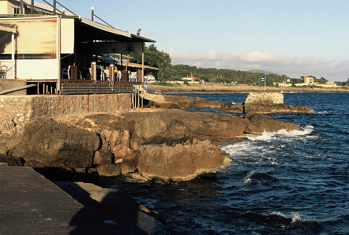 Rocky ourcrops behind the seaside restaurants of Marathopoli