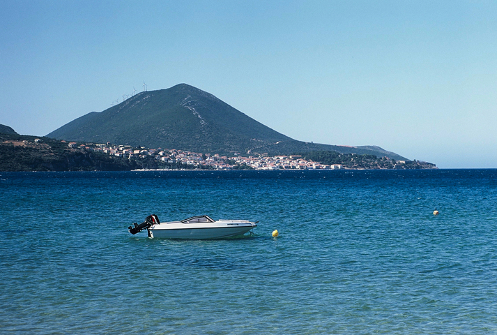 A view across the sea from Gialova to Pylos with a speedboat in the foreground
